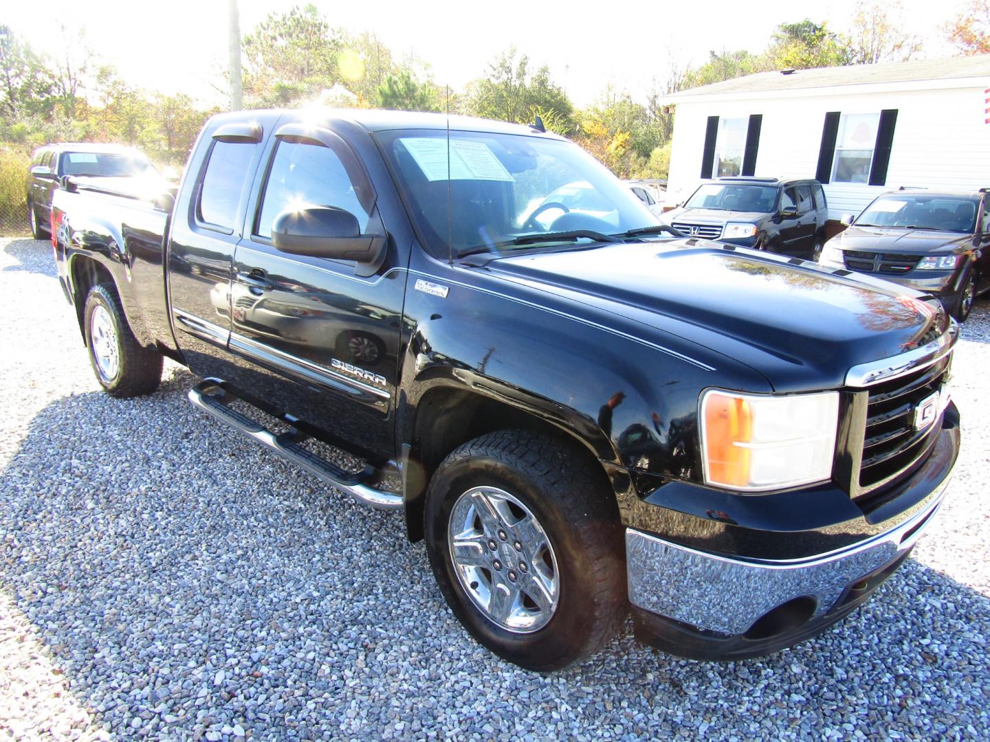 2011 Black GMC Sierra 1500 SLE Ext. Cab 2WD (1GTR1VE01BZ) with an 5.3L V8 OHV 16V FFV engine, Automatic transmission, located at 15016 S Hwy 231, Midland City, AL, 36350, (334) 983-3001, 31.306210, -85.495277 - Photo#0